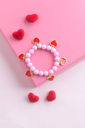 Kalpli Charm Detaylı Pembe Boncuk Bileklik – Lastikli Çocuk Bilekliği